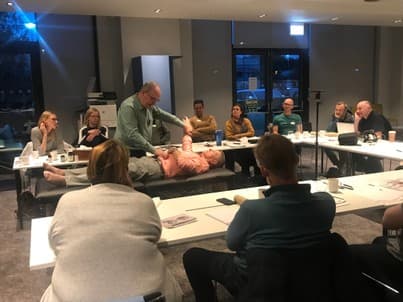 Practitioner demonstrating protective reflex testing during training